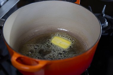 Doe de boter in de pan.